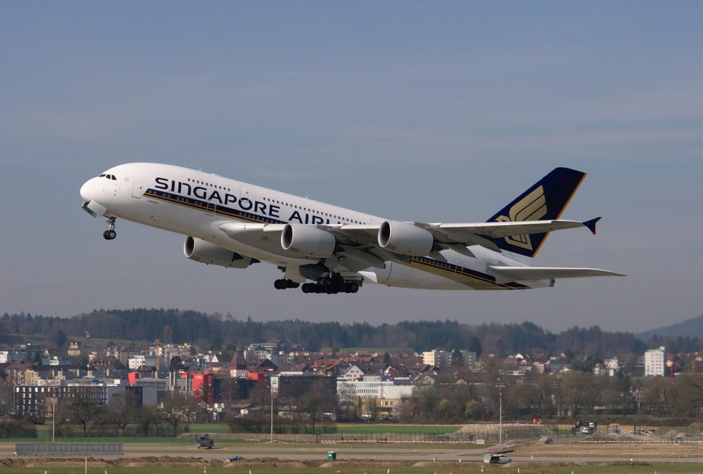 Book Singapore Airlines flights, featured by top US travel hacker, Points with Q: Singapore Airlines Plane