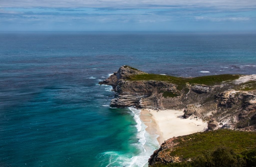 Best Ways to Fly to South Africa featured by top US travel hacker, Points with Q: Image of Cape of Good Hope South Africa 