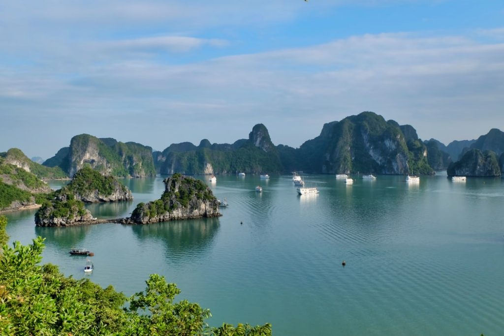 Best Ways to Fly to Asia featured by top US travel hacker, Points with Q: Image of Ha Long Bay Vietnam 