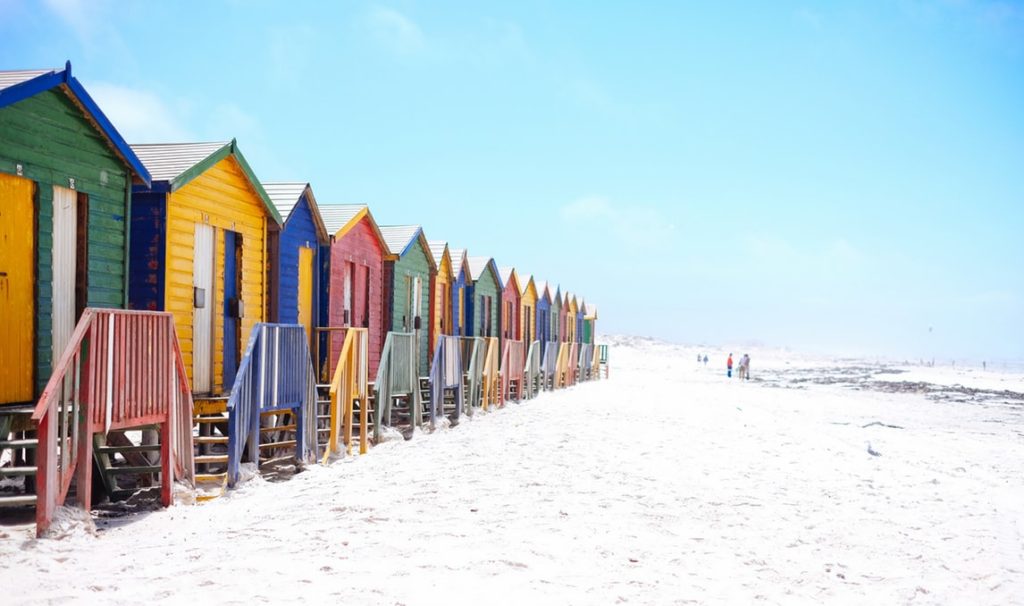 Best Ways to Fly to South Africa featured by top US travel hacker, Points with Q: Image of Muizenberg Cape Town South Africa
