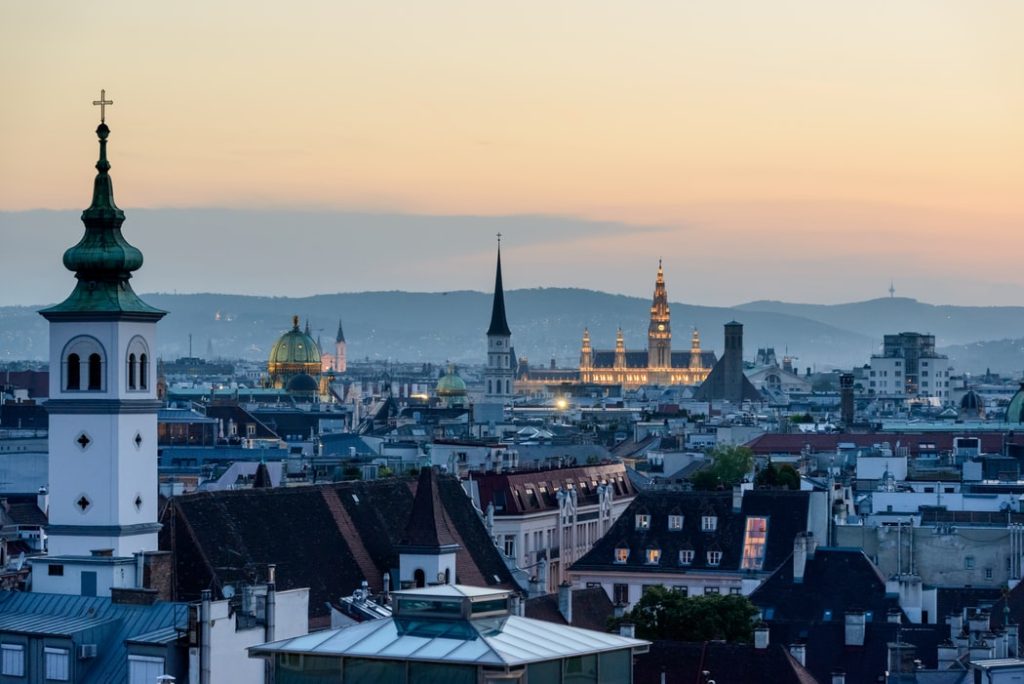 How to Use United Miles to fly to Europe featured by top US travel hacker, Points with Q: 
 image of Vienna Austria Buildings
