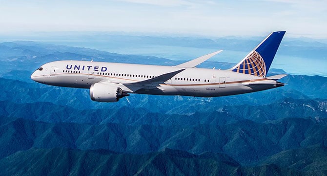 How to Use United Miles to fly to Europe featured by top US travel hacker, Points with Q: image of United Plane Mountains