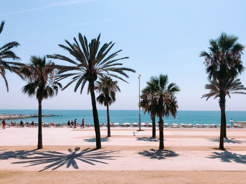 Use Iberia Avios featured by top US travel hacker, Points with Q: image of La Barceloneta Barcelona Spain