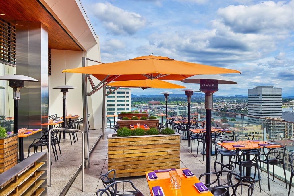The Best Things to See in Portland featured by top US travel hacker, Points with Q:  image of The Nines Departure Rooftop Terrace Portland Oregon
