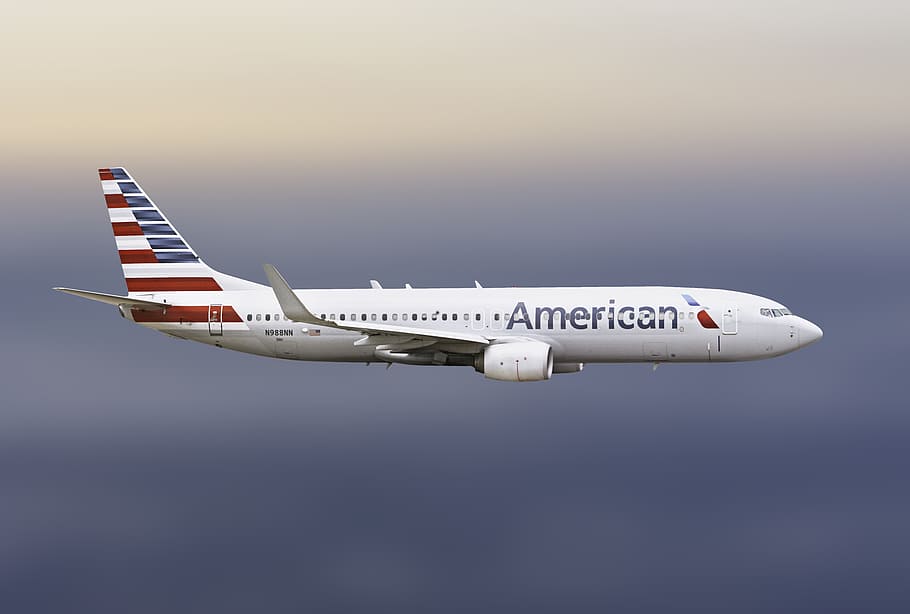 American Airlines Cancellation Policy featured by top US travel blog, Points with Q: image of American Airlines Plane Flying