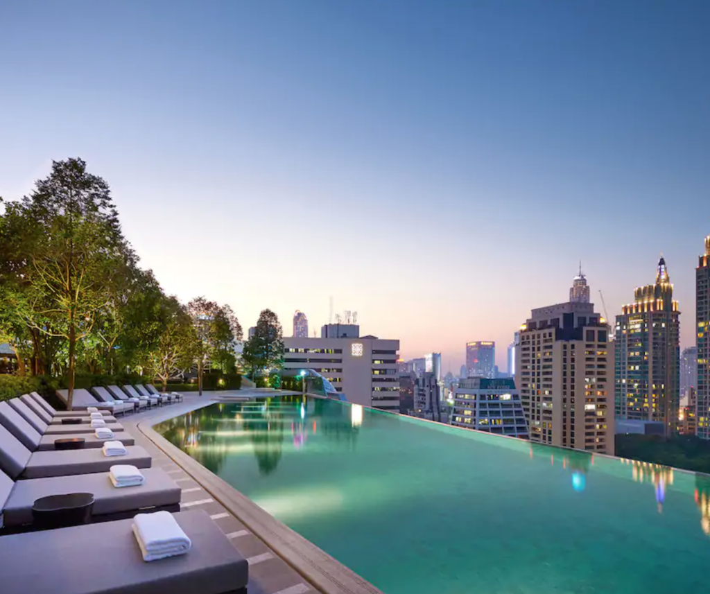 Thailand Vacation  featured by top US travel blog, Points with Q: image of Park Hyatt Bangkok Pool Dusk