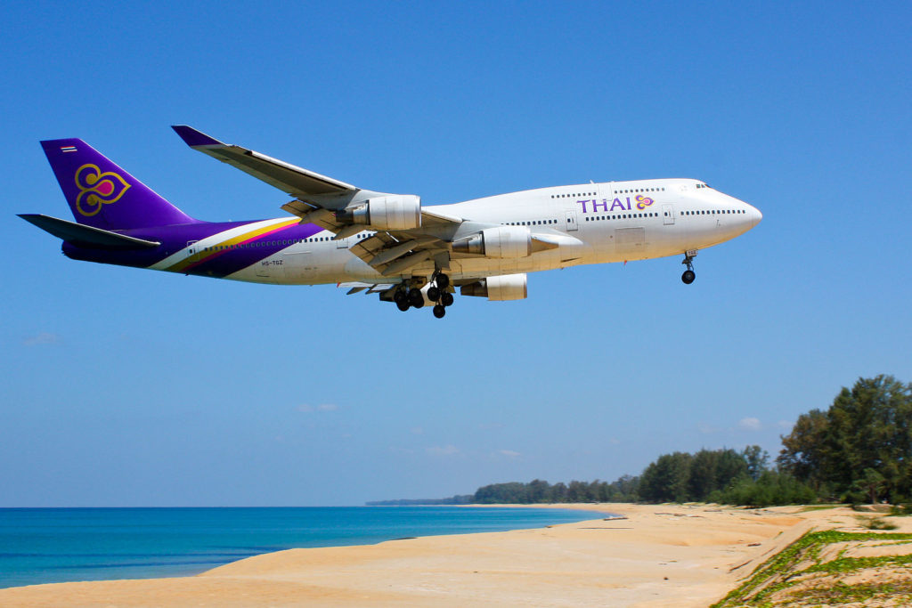 Thailand Vacation  featured by top US travel blog, Points with Q: image of Thai Airways B747-400 Plane Phuket