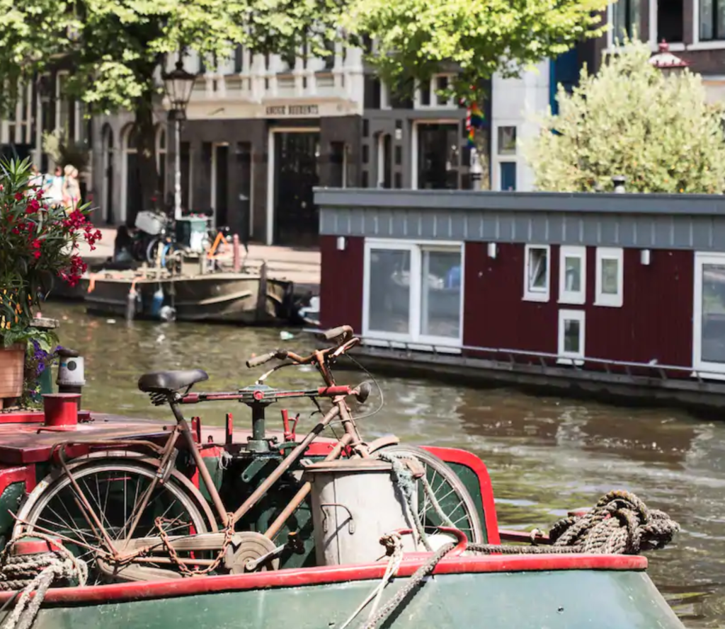 A Complete Guide to the Various Hyatt Hotels Brands featured by top US travel blog Points With Q, image: Hyatt Regency Amsterdam City Canal Bicycle Environment