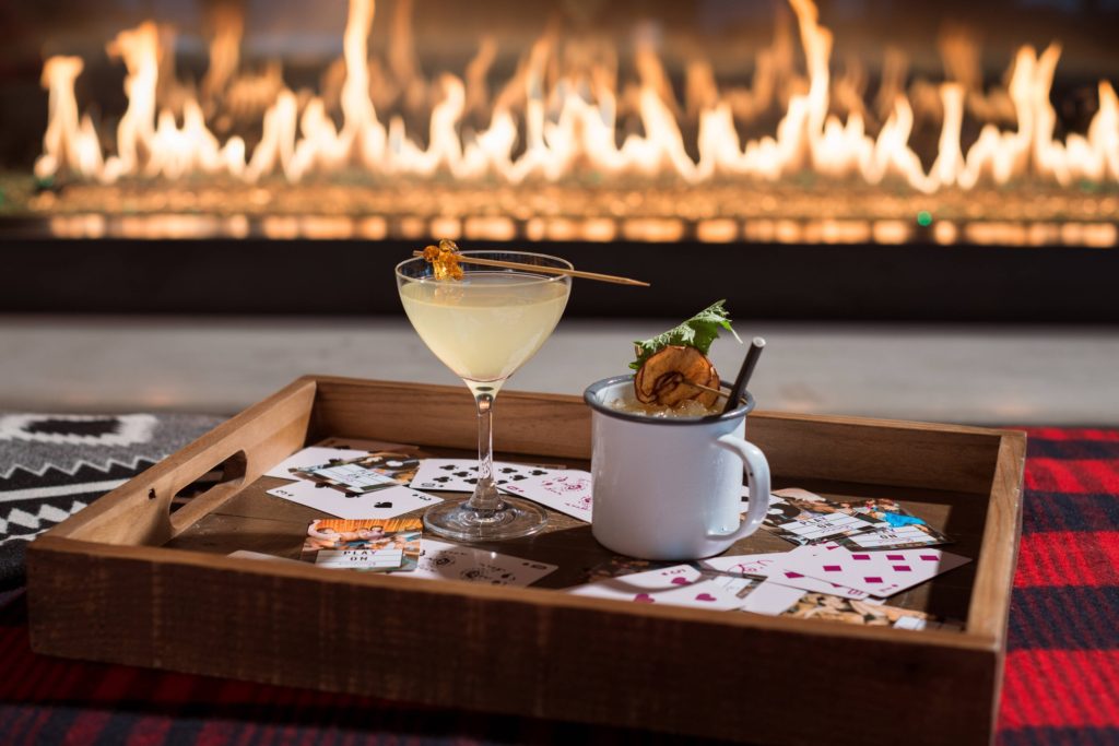 Seattle Travel: Places to Visit in Seattle in 48 Hours featured by top US travel blog, Points with Q: image Seattle Moxy Marriott Fireplace Drinks