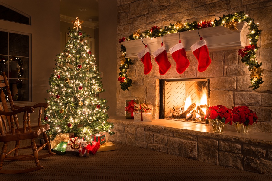 Christmas. Glowing fireplace, hearth, tree. Red stockings. Gifts and decorations.