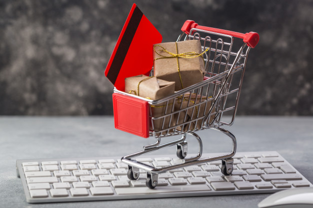 Small Shopping Cart With Presents Credit Card Laptop Keyboard
