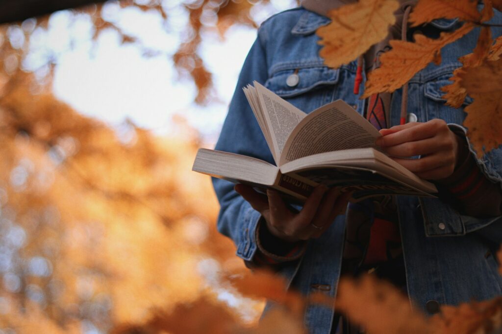 a person holding a book in their hands