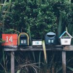 six assorted-color mail boxes