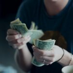 free cash flow lesson focus photography of person counting dollar banknotes