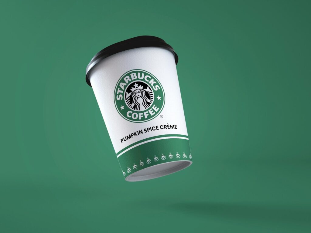 Howard Schultz during Starbucks pricing strategy during the Great Financial Crisis a starbucks coffee cup flying through the air