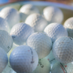 white golf ball on green golf course