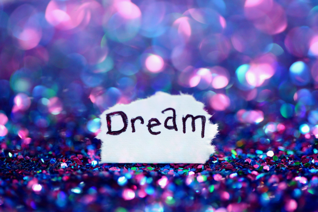 Business Lessons Dream signage surrounded sequins