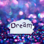 Business Lessons Dream signage surrounded sequins